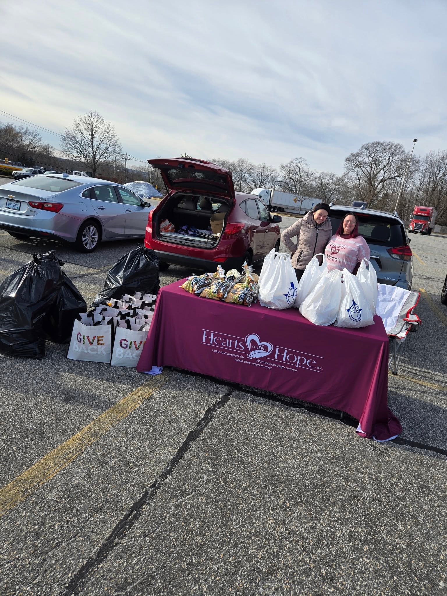 Hearts with Hope volunteers and members gathered at a community event
