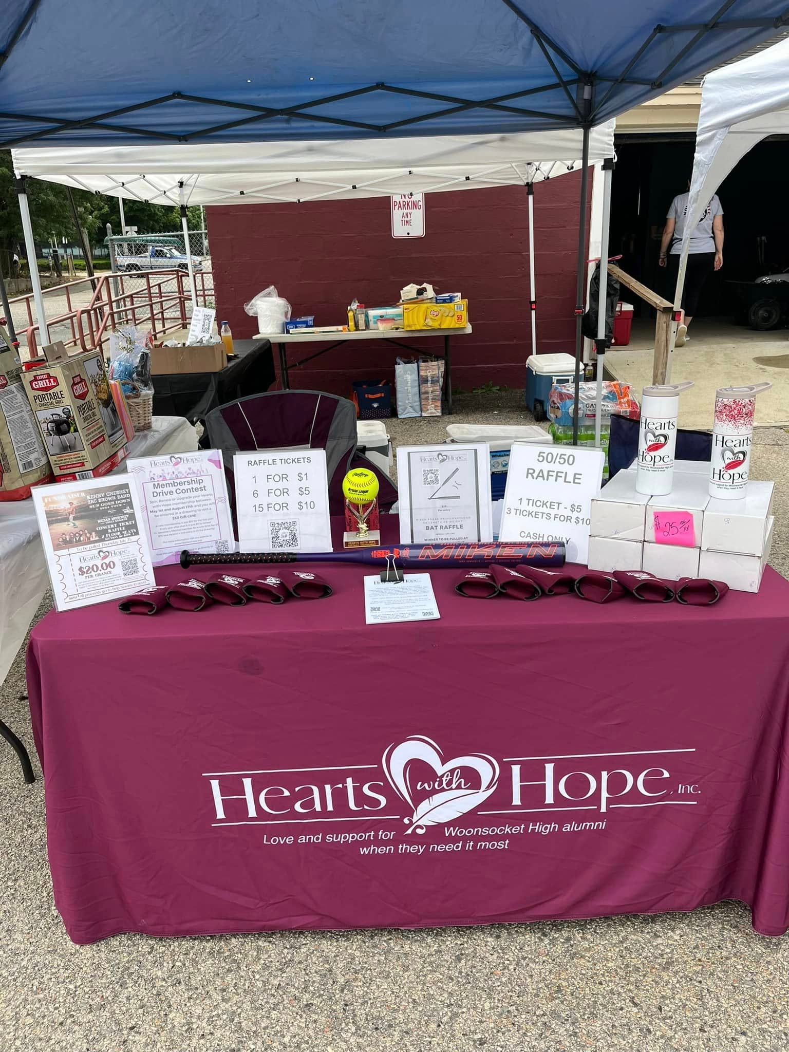 Hearts with Hope volunteers and community members at an event
