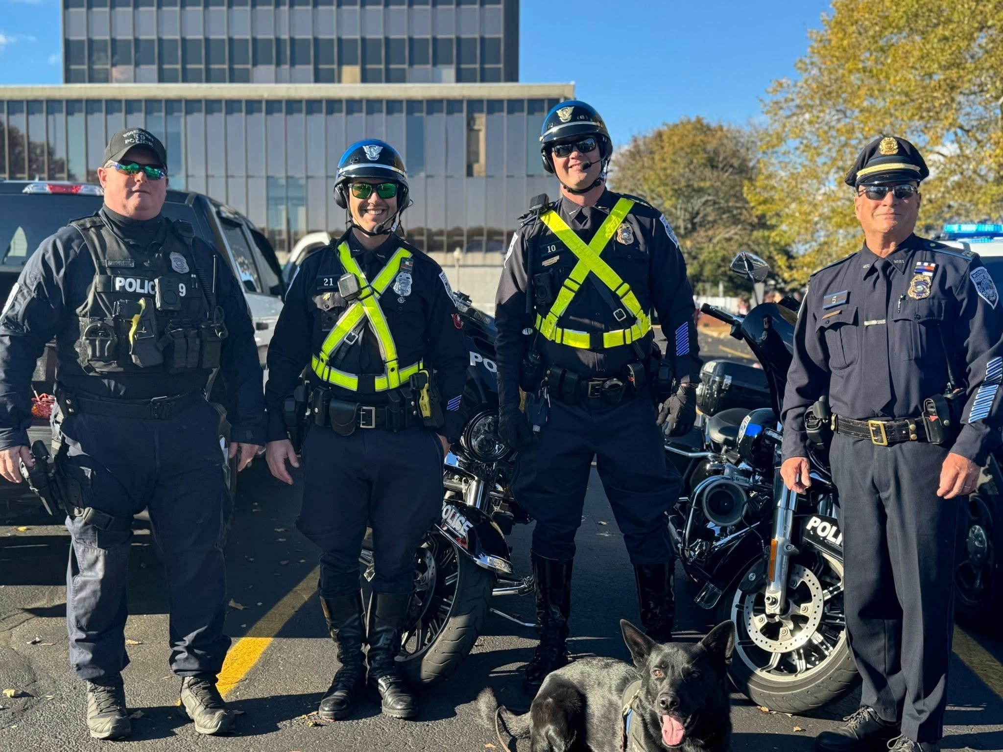 Police officers and K-9 unit at a Hearts with Hope Trunk or Treat event
